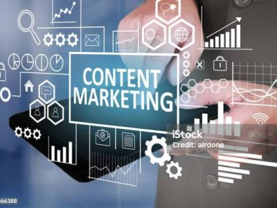 Business Concept. Businessman click content marketing button on his tablet. Goals Text typography design